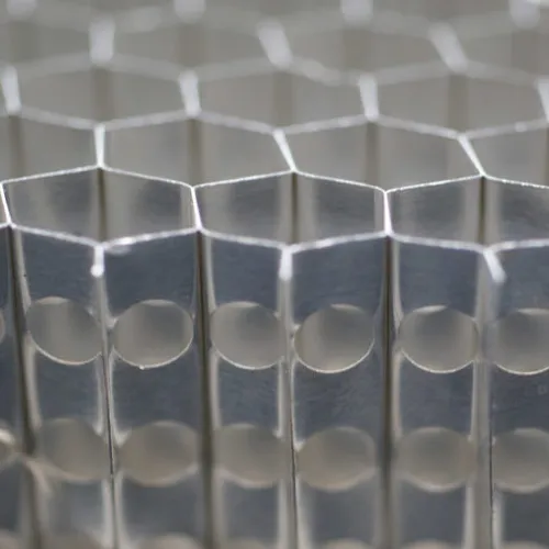 Perforated aluminum honeycomb core for venting, drainage, and pressure equalization